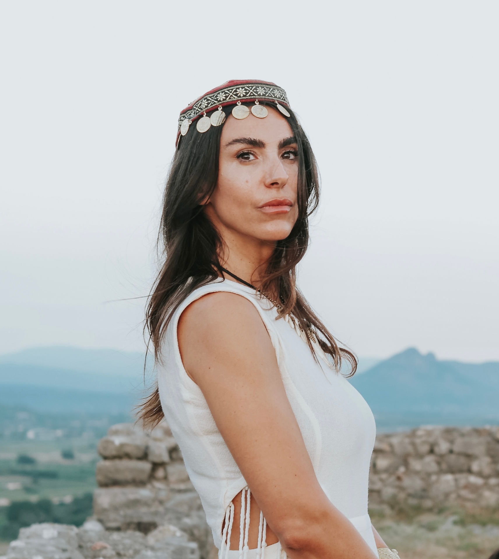 Anisa, growth strategist and coach, in a white blazer